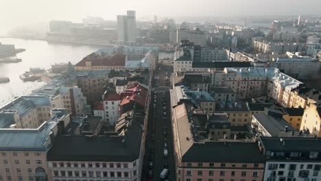 Aerial-Footage-of-Urban-Shipyard-in-Helsinki,-Finland-on-a-Foggy-Day,-Finland