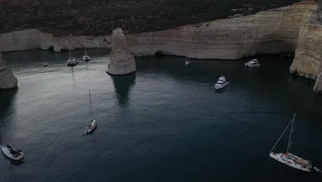 60-Dolly-shot-of-a-yachts-in-the-beautiful-summer-afternoon-at-Milos-Greece