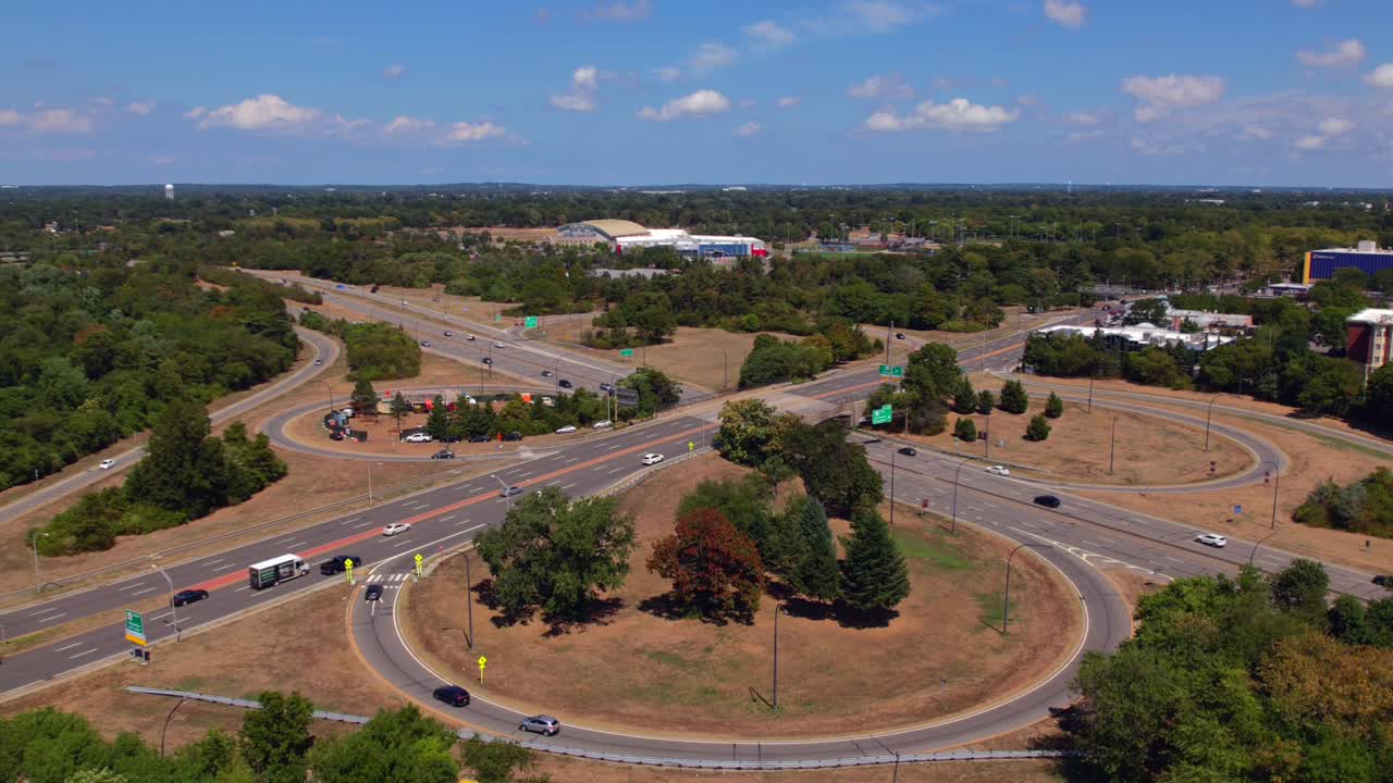 An Aerial Time Lapse Of A Highway Intersection With Entrance And Exit ...