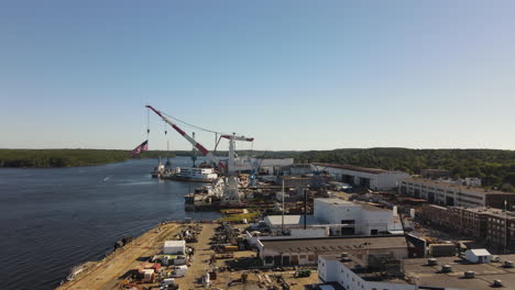 Aerial-ascent-at-the-Bath-Iron-Works-Shipyard,-US-Government-Destroyer-Building-site