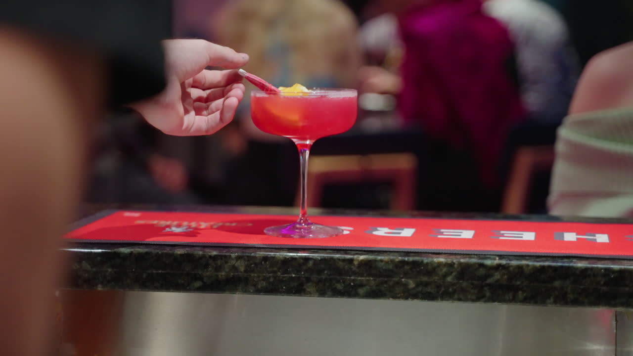 Premium stock video - 4k slow motion of bartender placing fruit and ...