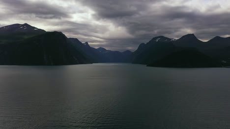 Aerial-view-over-the-Storfjorden,-towards-the-Geirangerfjord,-rainy,-summer-day-in-Norway