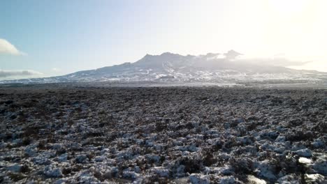 Beautiful-aerial-of-Mount-Ruapehu-volcano,-snow-capped-peak-during-winter-in-New-Zealand