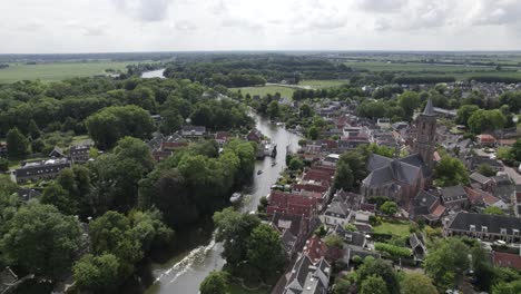 Aerial-view-of-the-traditional-Dutch-village-Loenen-aan-de-Vecht,-church-by-the-river