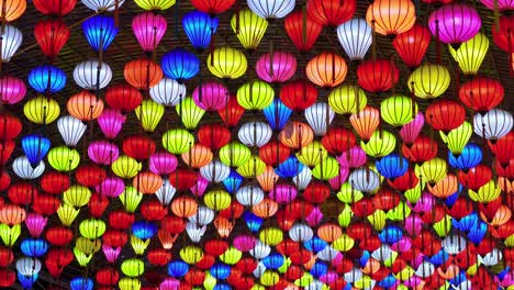 Low-angle-shot-of-colorful-lantern-lit-up-in-the-ceiling-along-the-streets-of-Lang-Son-City,-Vietnam-at-night-time