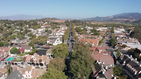 Aerial-shot-flying-over-the-main-street-of-the-charming-Danish-town-of-Solvang,-California