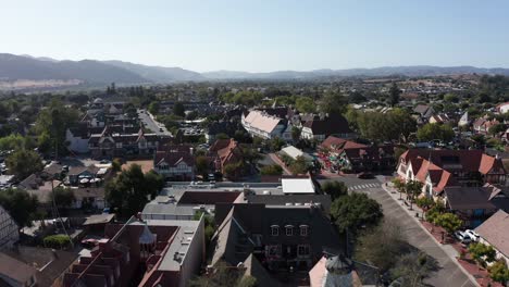 Low-aerial-shot-flying-over-the-quaint-Danish-village-of-Solvang,-California