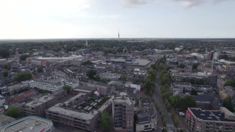 Aerial-city-view-over-Hilversum,-fly-past-Roman-Catholic-Saint-Vitus-Church