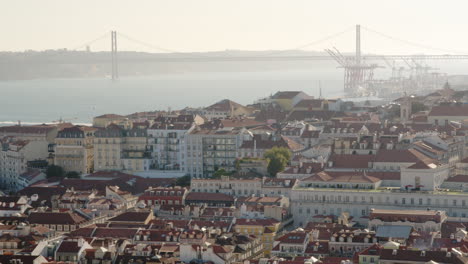 View-to-The-25-de-Abril-Bridge-in-Lisbon-during-Golden-Hour-in-Summer