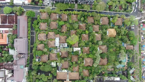 Luxury-villa-rooftops-in-resort-area-of-Bali,-aerial-top-down-view