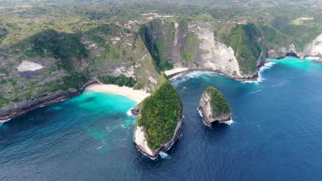 Majestic-view-of-Nusa-Penida-island-with-tall-cliff-and-sandy-beaches,-aerial-orbit-view