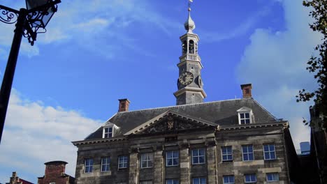 Slow-dolly-zoom-pas-old-lantern-to-City-Hall-'s-Hertogenbosch-clock-tower