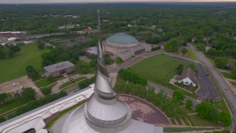 Wide-drone-aerial-temple-lot,-visitors-center-at-Independence-Missouri-with-the-Church-of-Christ,-Community-of-Christ,-Remnant-and-The-Church-of-Jesus-Christ-of-Latter-day-Saints