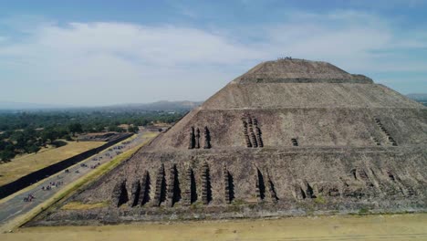 Aerial-view-around-the-Pyramid-of-the-moon,-in-sunny-Teotihuacan,-Mexico---orbit,-drone-shot