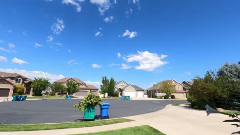 Typical-suburban-neighborhood-on-a-sunny-summer-day---panning-time-lapse