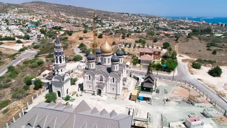 Aerial-drone-footage-of-the-new-construction-of-Russian-orthodox-church-Saint-Nicholas-in-Limassol,-Cyprus