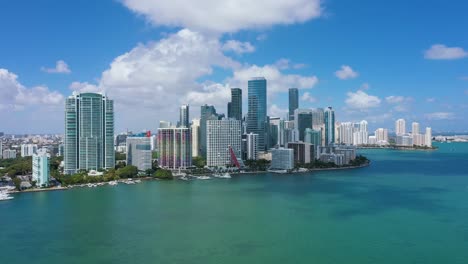 Aerial-view-of-seaside-skyscrapers-in-Brickell,-Miami,-USA---ascending,-drone-shot