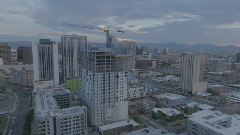 Rotating-drone-shot-of-hotel-construction-at-twilight