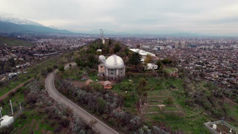 Aerial-orbit-of-the-dome-of-the-astronomical-observatory-of-Calan-hill-in-Las-Condes,-Chile