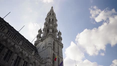 Looking-up-the-townhall-of-Brussels-against-blue-summer-sky---POV