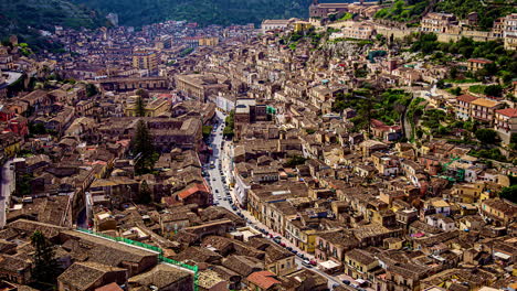 City-of-Modica,-Sicily,-Italy,-High-angle-view-timelapse-of-old-buildings