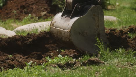 Mini-excavator-bucket-digging