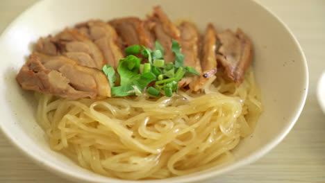 Dried-noodles-with-stewed-duck-in-white-bowl---Asian-food-style-1