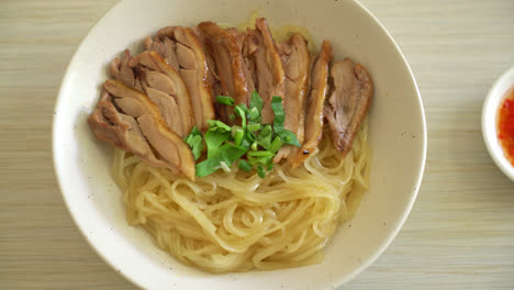 Dried-noodles-with-stewed-duck-in-white-bowl---Asian-food-style