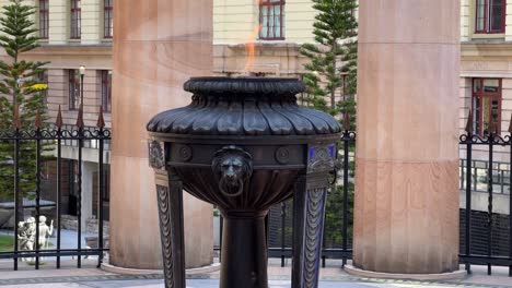 Close-up-static-shot-of-shrine-of-remembrance-and-eternal-flame-burning-at-its-heart,-Anzac-Square-war-memorial-parklands-at-Brisbane-city,-central-business-district,-Queensland,-Australia