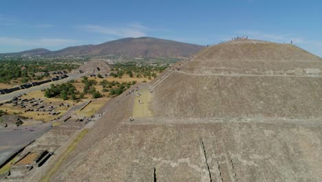 People-climbing-on-a-Teotihuacan-Pyramid-at-the-Aztec-Ruins-National-Monument,-in-San-Juan,-Mexico---Aerial-view