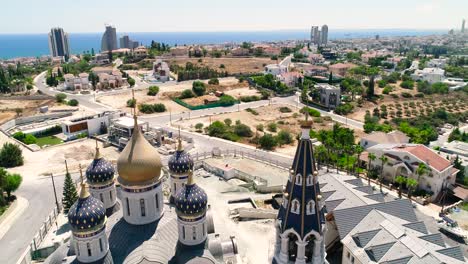 Aerial-drone-footage-of-the-new-Russian-orthodox-church-Saint-Nicholas-in-Limassol,-Cyprus-with-sea-view-1