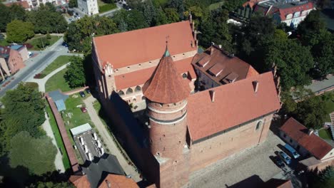 Slow-drone-shot-of-a-gothic-castle-in-Eastern-Europe-Poland,-Aerial-footage
