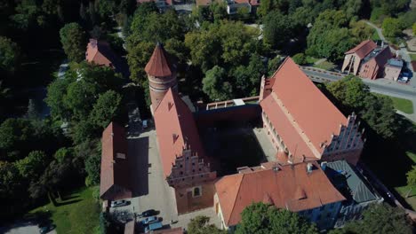 Aerial-view-Of-Old-Polish-Castle-Roofs-And-Facade
