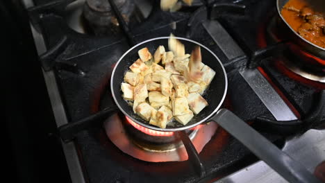 Stir-fry-the-Turkish-bread-with-butter-in-a-saucepan-on-the-gas-stove,-preparation-of-Turkish-kebab