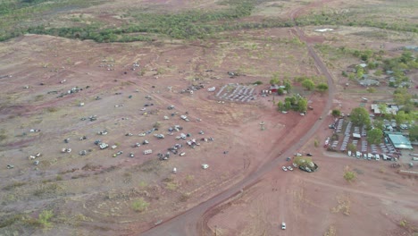 Panning-aerial-view-of-the-community-of-Kalkaringi-during-the-Freedom-Day-Festival,-Northern-Territory-Australia,-26-August-2022
