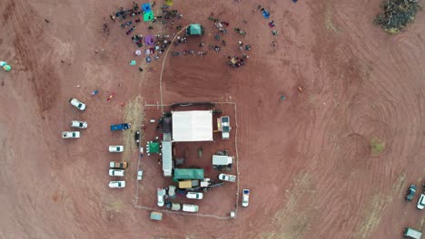 Vertical-and-rising-drone-view-of-the-band-stage-at-the-Freedom-Day-Festival,-Kalkaringi,-Northern-Territory-Australia,-26-August-2022
