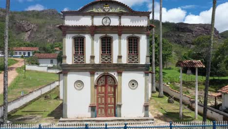 Aerial-drone-view-of-colonial-style-old-church-around-rocky-hills
