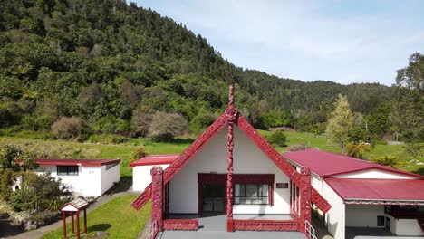 Maori-carved-traditional-art-on-Marae,-meeting-room-on-Rotoiti-lake