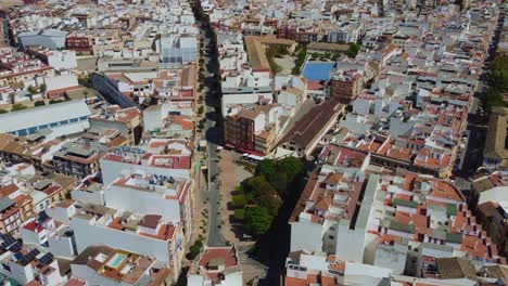 Aerial-View-of-Puente-Genil,-Scenic-City-in-Andalusia,-Spain,-Downtown-Neighborhood-and-El-Romeral-Street,-Drone-Shot