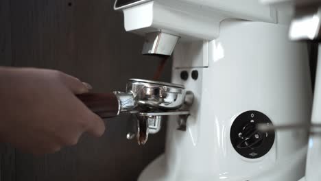 Close-up-slow-motion-of-barista-making-fresh-coffee---Brewing-Espresso-Coffee-At-Cafe