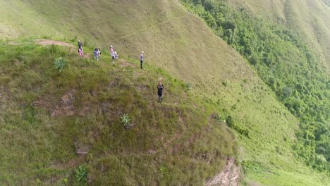 Group-people-stand-on-top-mountain-enjoy-nature-sight,-loma-las-Vacas-Venezuela