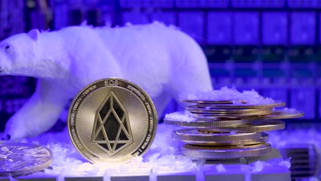 Eos-coin-digital-cryptocurrency-Bear-Market-Concept,-snow-fall-freeze-price,-close-up