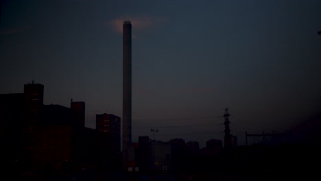 Timelapse-shot-of-the-morning-sunrise-over-the-Suvilahti-power-plant-until-midday