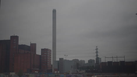 Timelapse-shot-of-grey-clouds-passing-over-the-Suvilahti-power-plant