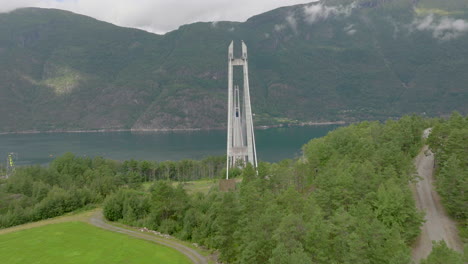 Flying-towards-Hardanger-Bridge-in-Norway,-over-a-Fjord