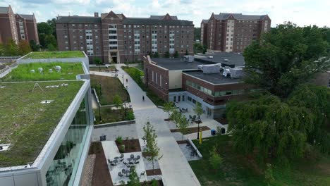 Aerial-tilt-up-shot-reveals-college-dorm-building