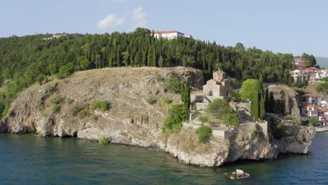 Drone-around-Cliff-on-Lake-Ohrid-with-St-John-of-Kaneo-Church,-Summer-North-Macedonia
