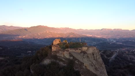 Drone-shot-orbiting-Castle-of-Oris-in-Catalonia-mountains-in-Spain