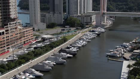 Aerial-Shot-of-Yachts-and-Boats-Moored-at-Rio-CamboriÃº,-Sunny-Day