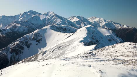 Beautiful-aerial-view-over-Mt-Fyffe-summit-reveal-winter-alpine-scenery-of-New-Zealand-landscape